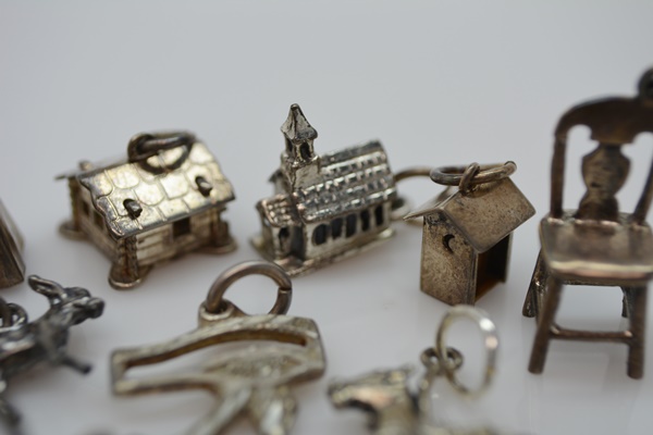 Thirteen Sterling Silver Charms