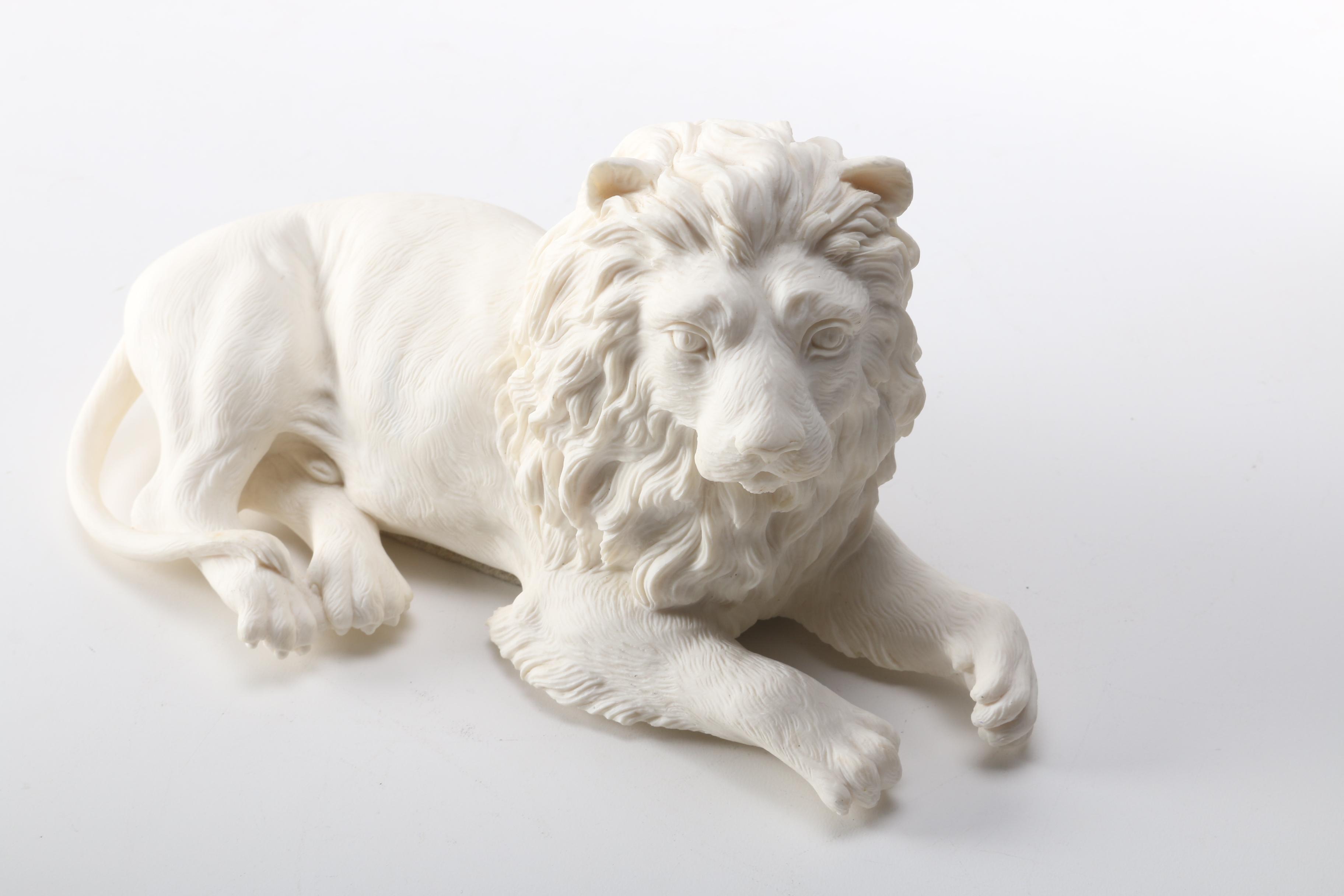 Figurines of a Lion and Two Dogs Featuring Chelsea House