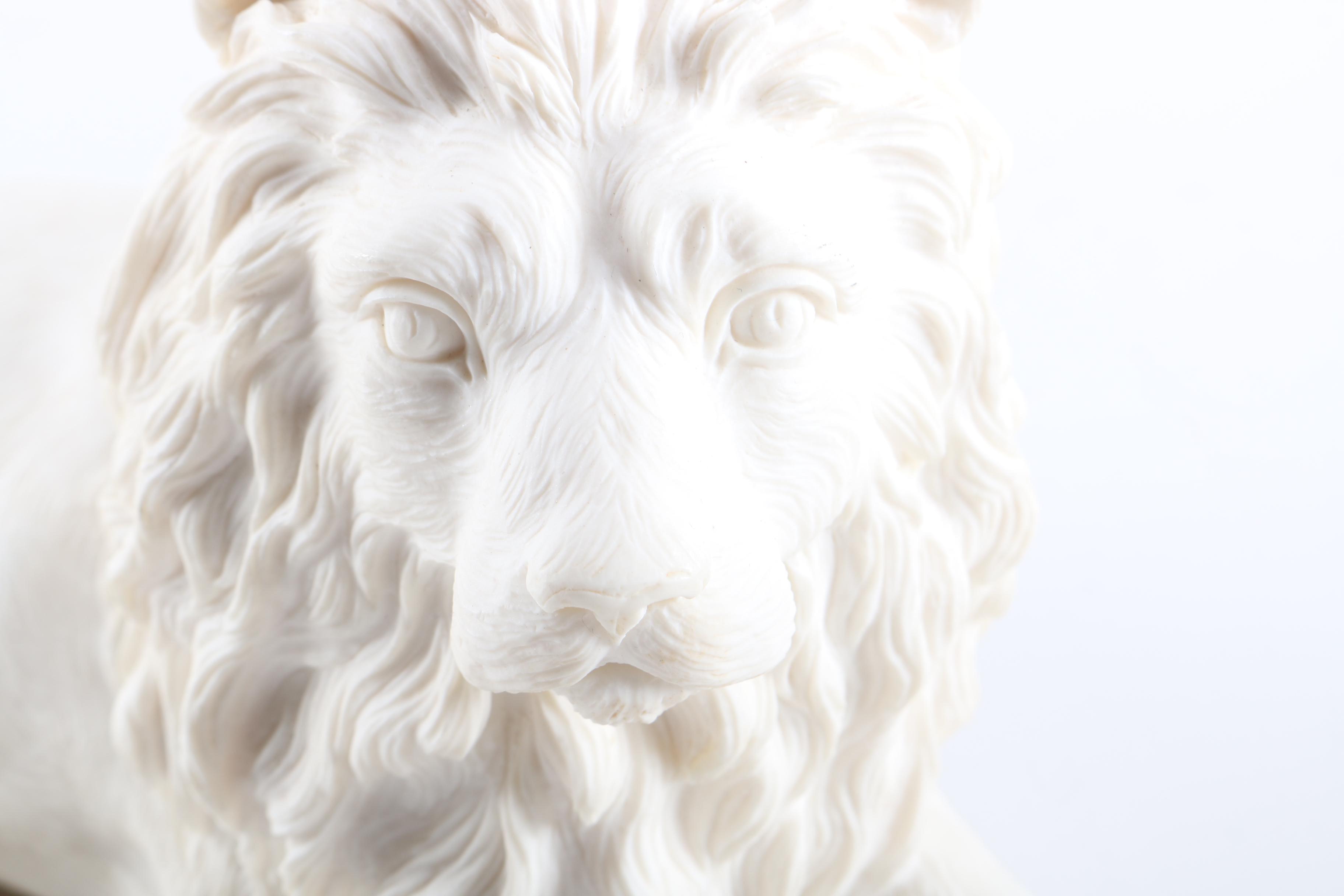 Figurines of a Lion and Two Dogs Featuring Chelsea House