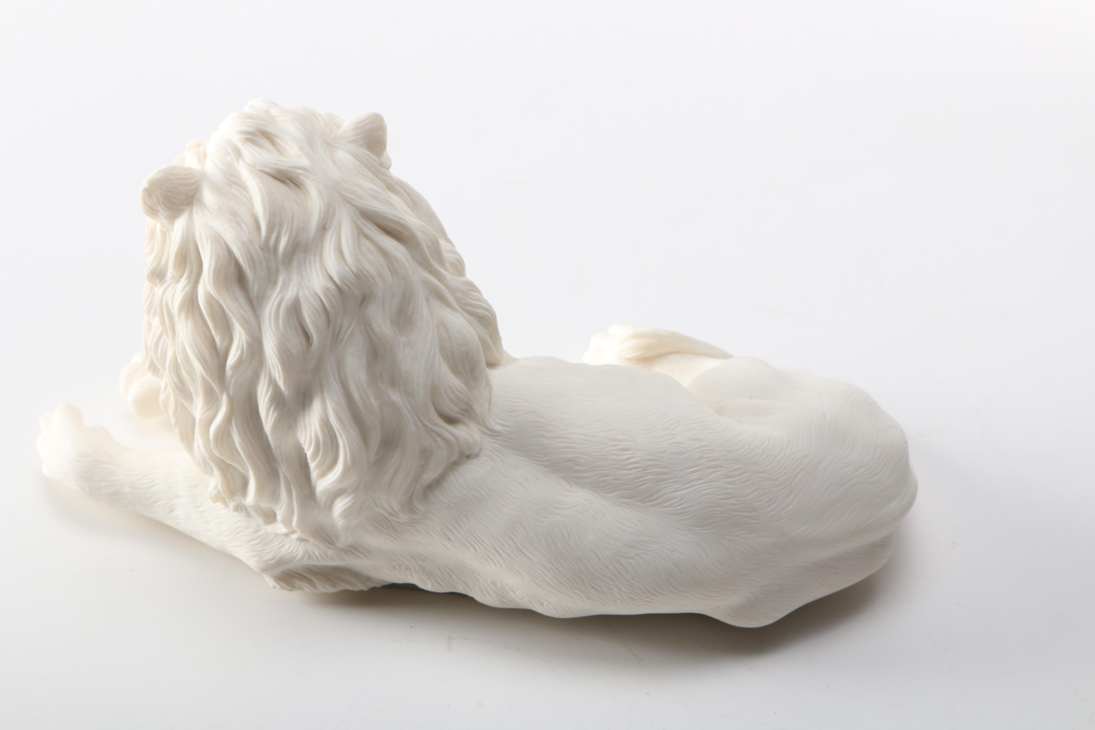 Figurines of a Lion and Two Dogs Featuring Chelsea House