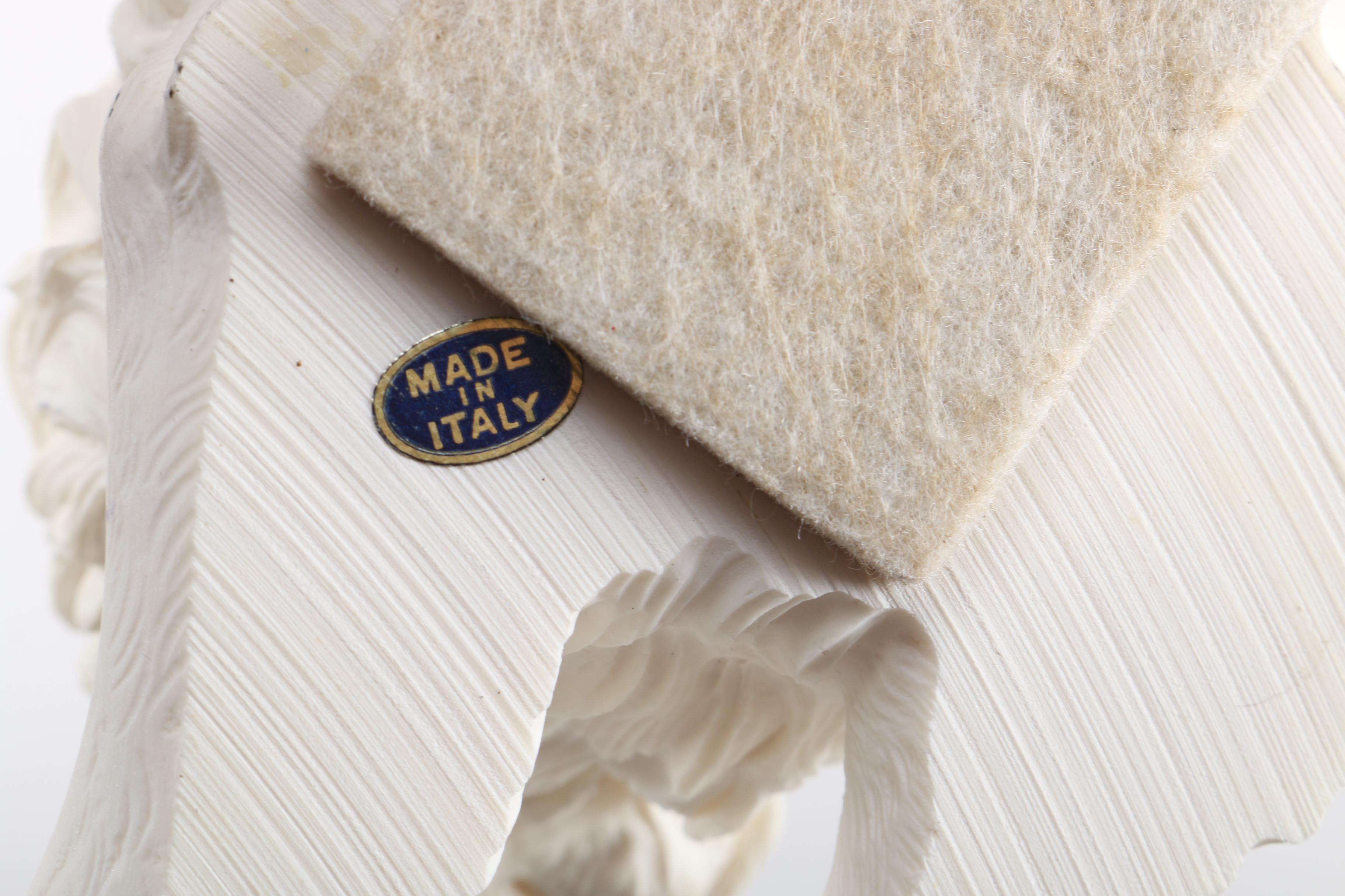 Figurines of a Lion and Two Dogs Featuring Chelsea House