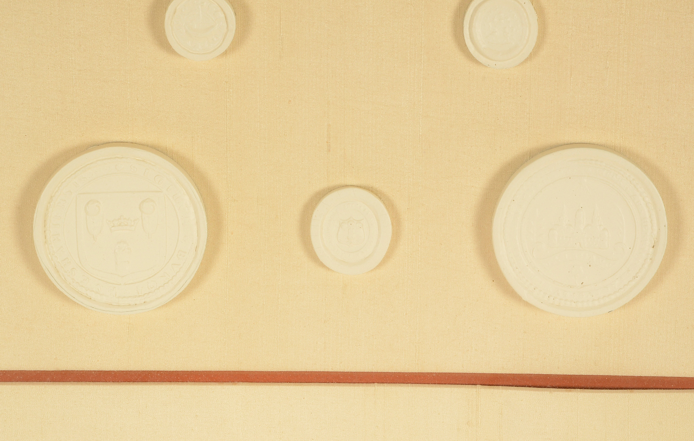 Framed Display of Plaster Intaglio Molds After Medieval Seals
