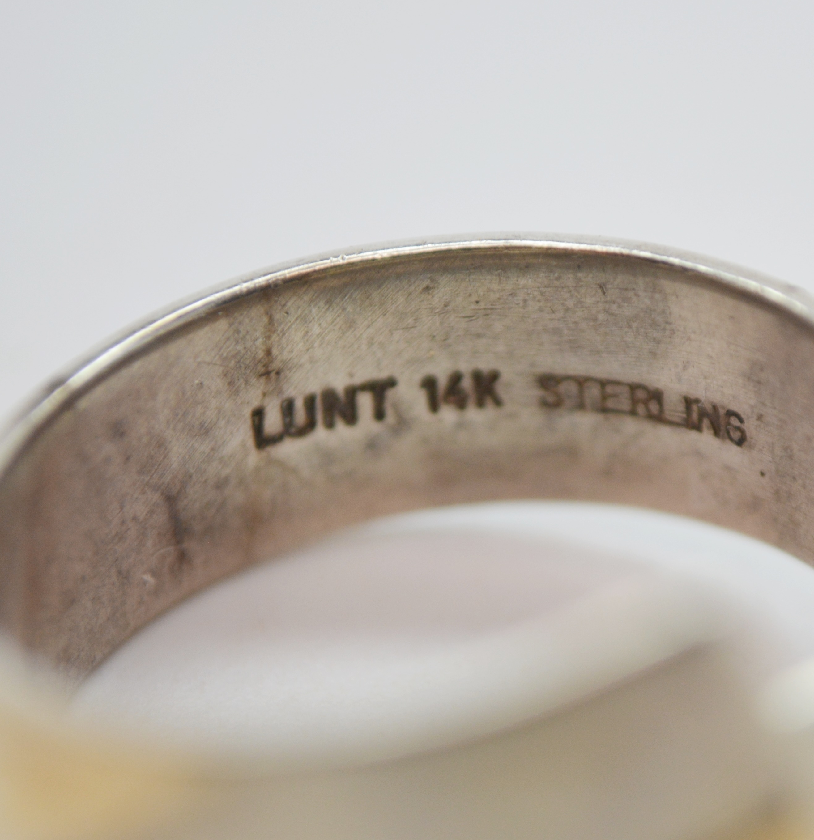 Three Sterling Silver Rings and One 900 Silver Brooch