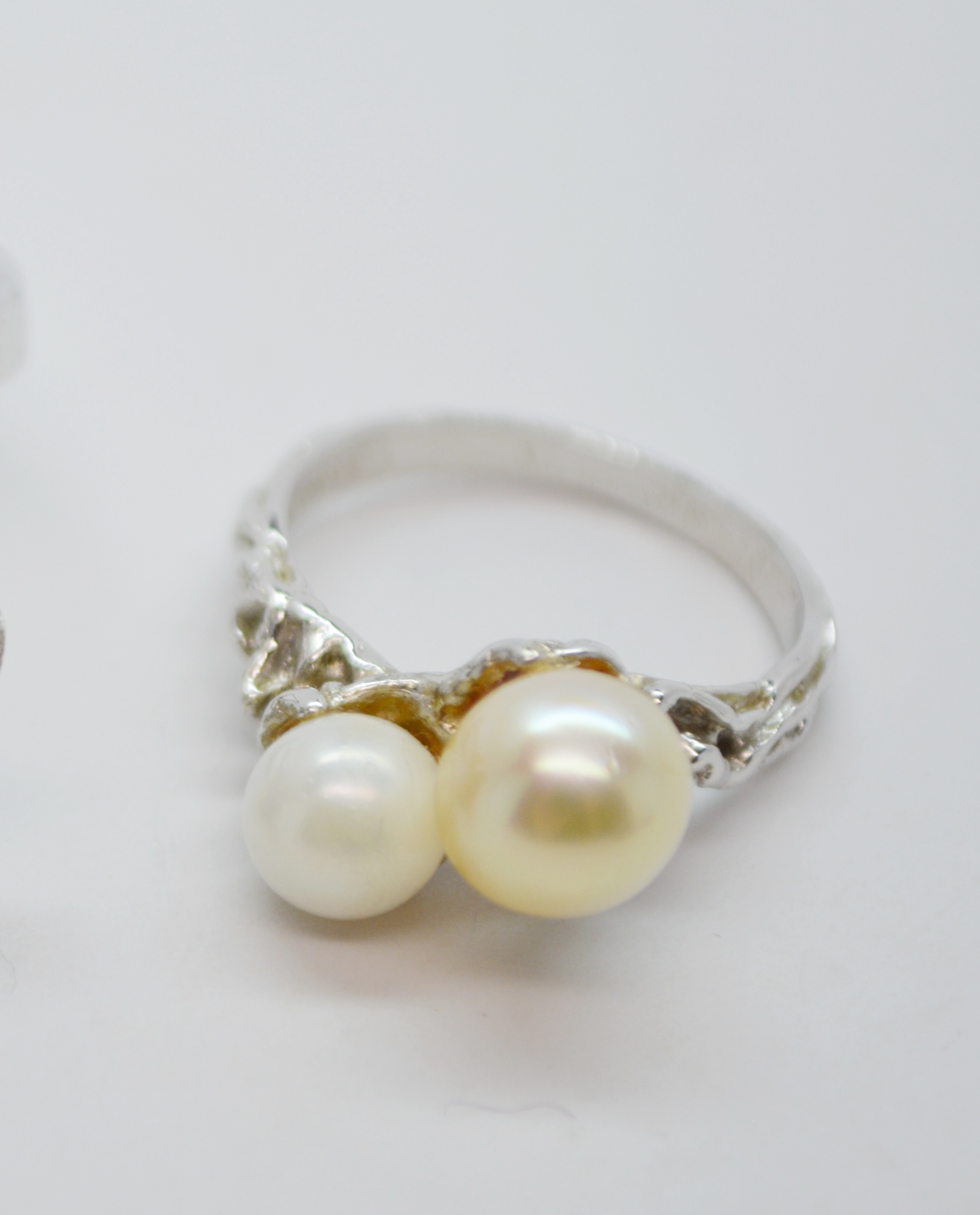 Three Sterling Silver Rings and One 900 Silver Brooch