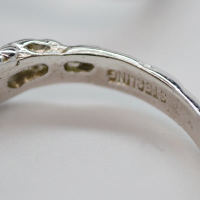 Three Sterling Silver Rings and One 900 Silver Brooch