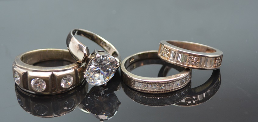 Four Sterling Silver Cubic Zirconia Rings