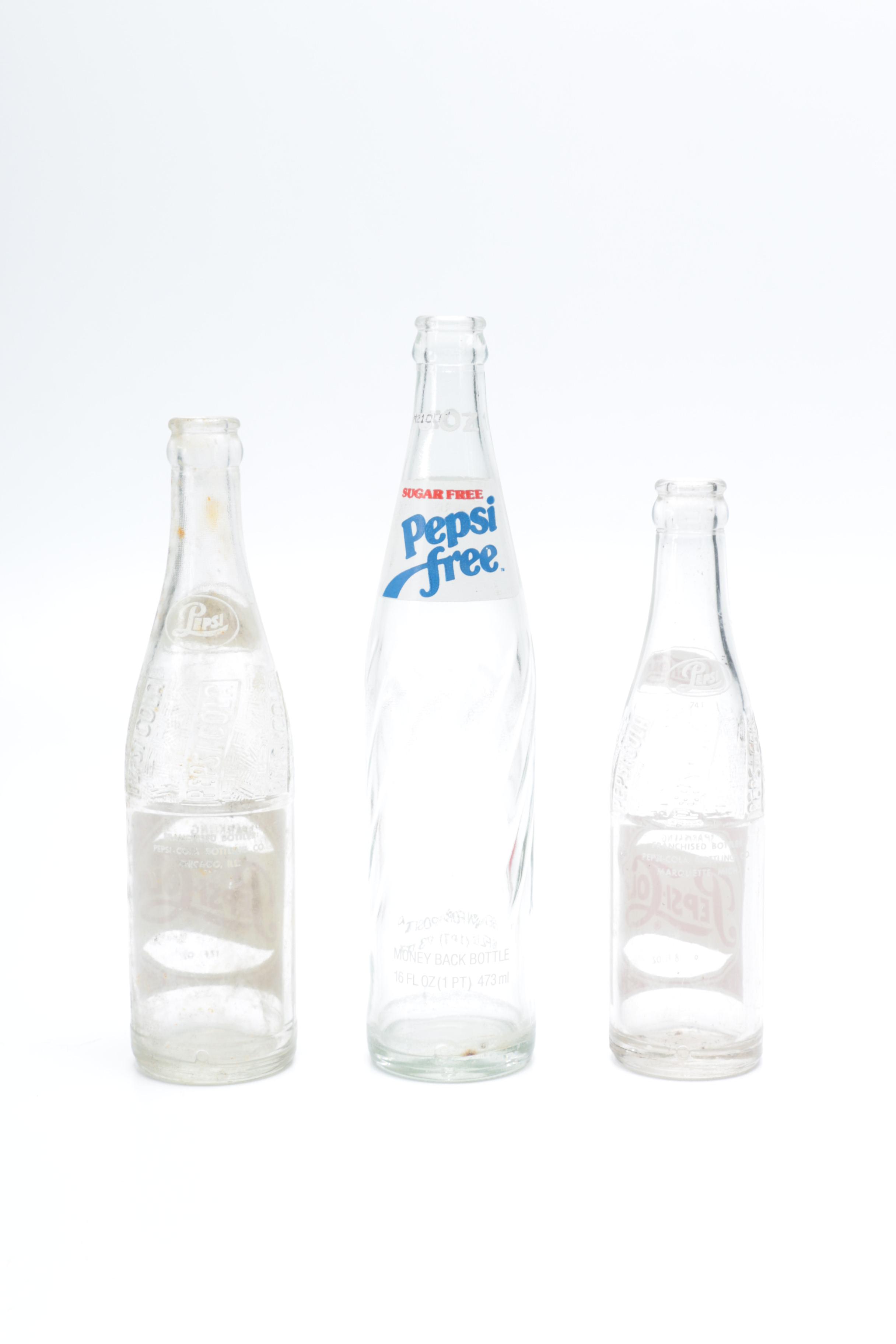 Collection of Pepsi Bottles and Cans