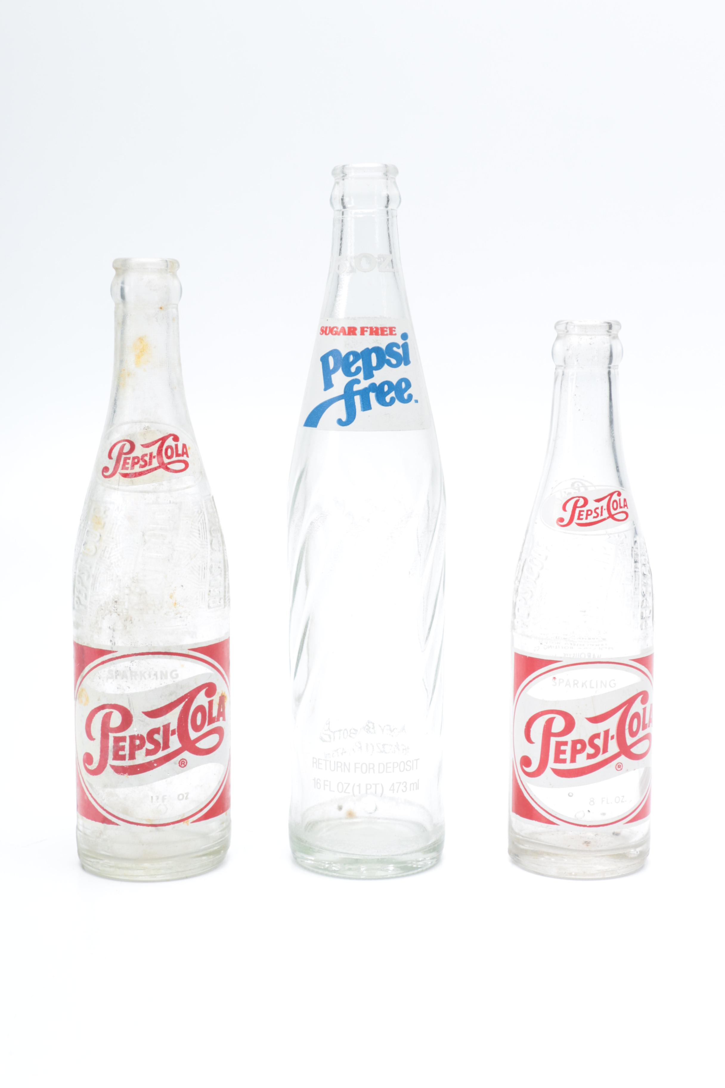 Collection of Pepsi Bottles and Cans