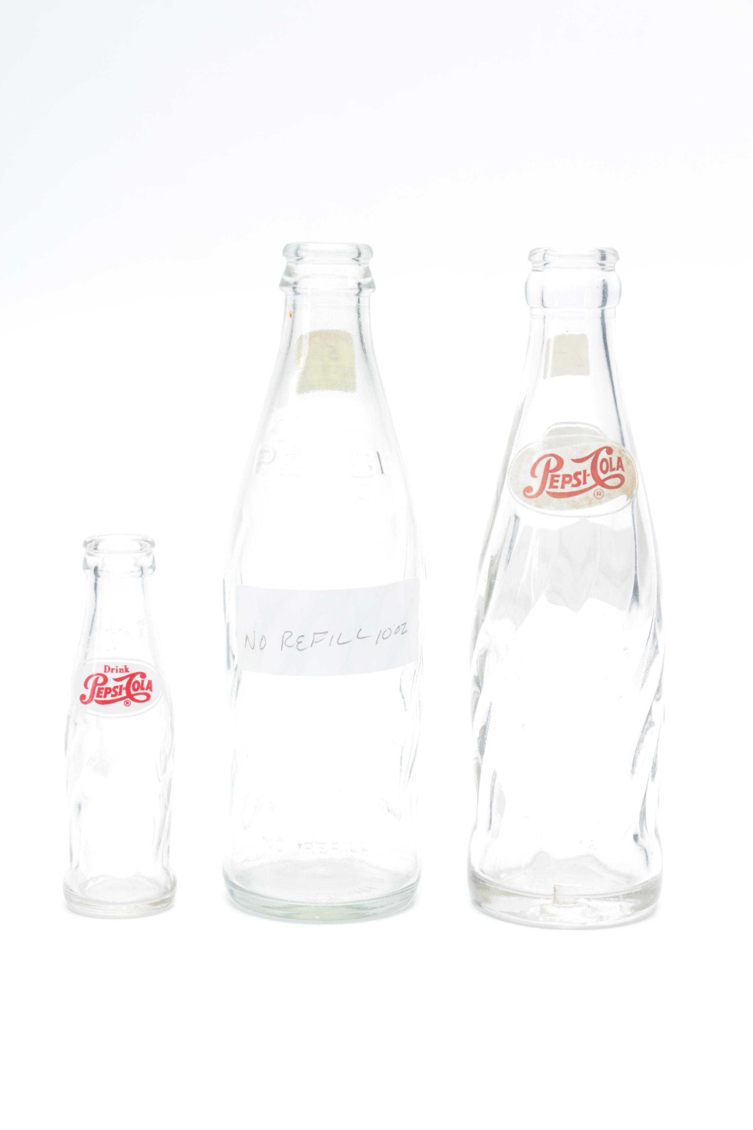 Collection of Pepsi Bottles and Cans