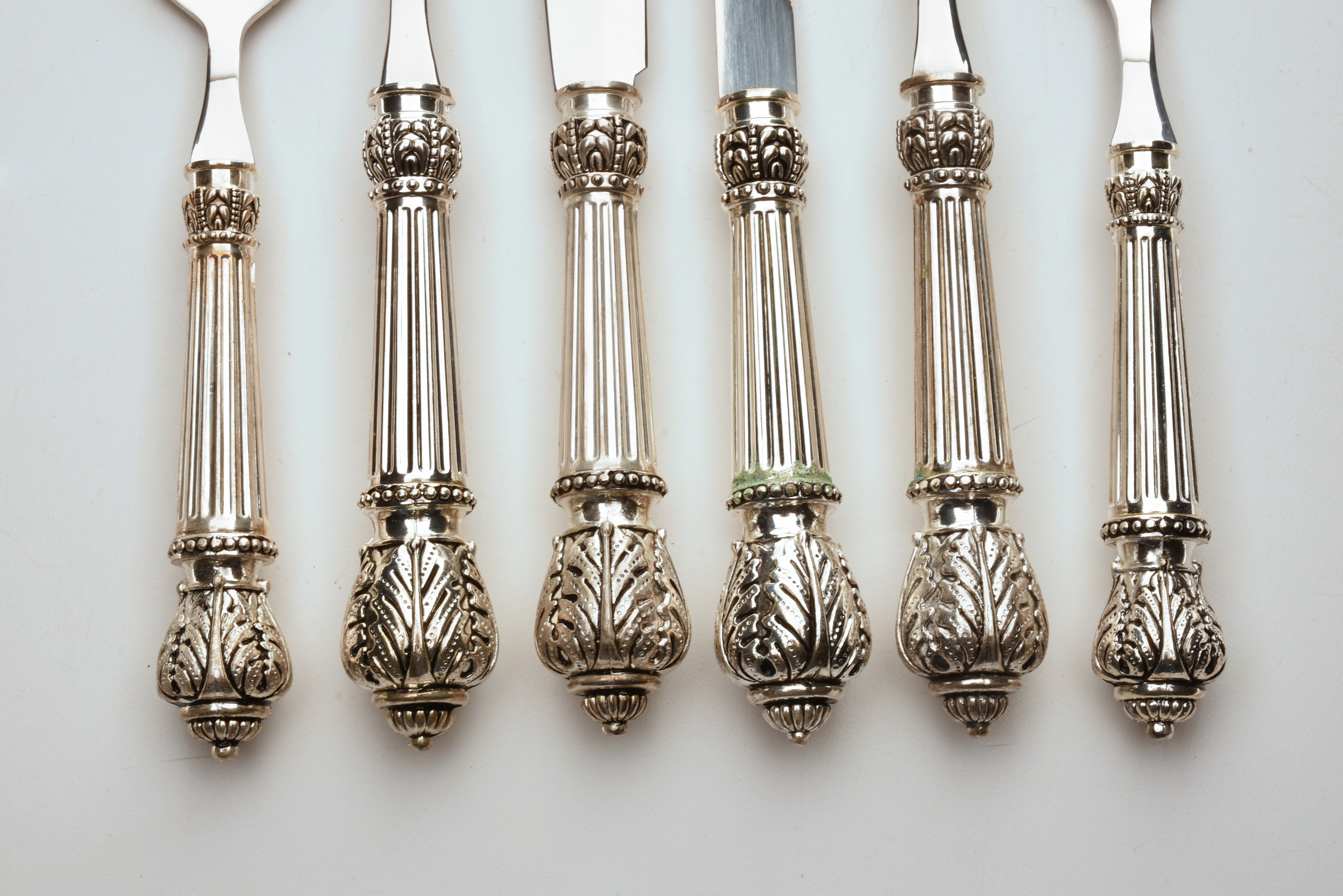 Elegant Flatware with Round Reeded Handles and Acanthus Reede