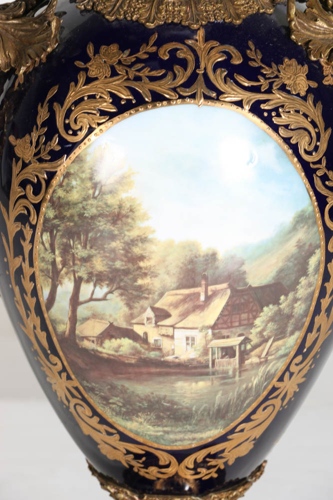 Pair of Porcelain Urns with Figural Handles