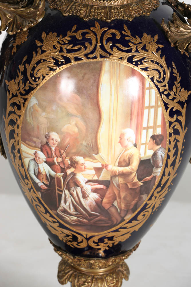 Pair of Porcelain Urns with Figural Handles