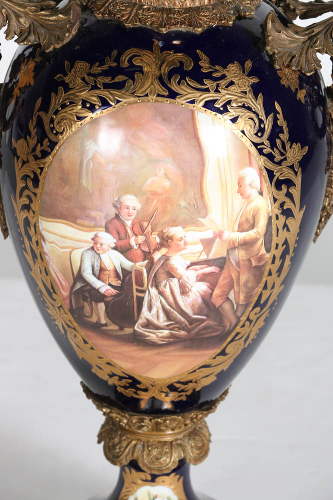 Pair of Porcelain Urns with Figural Handles