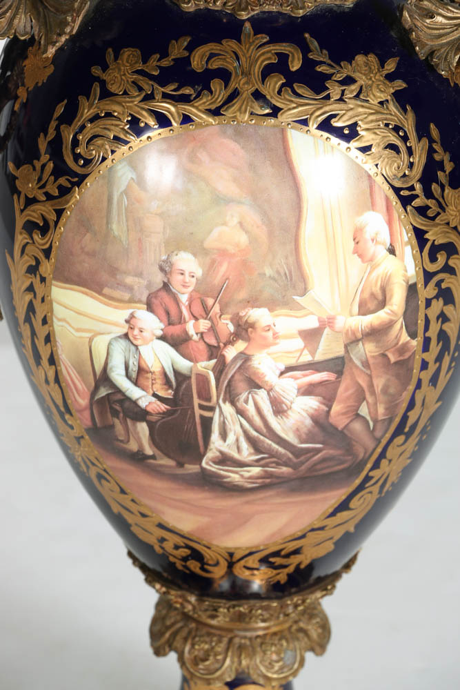 Pair of Porcelain Urns with Figural Handles