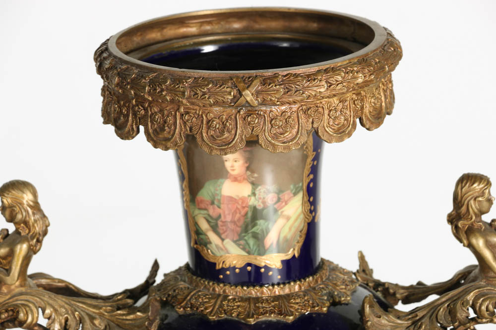 Pair of Porcelain Urns with Figural Handles
