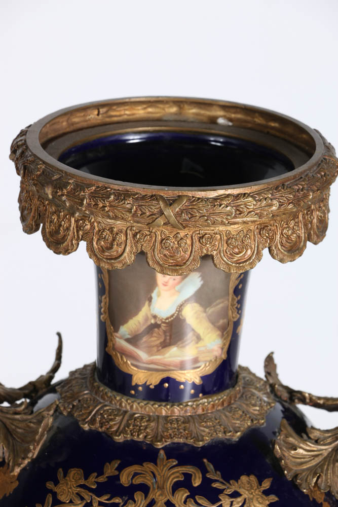 Pair of Porcelain Urns with Figural Handles