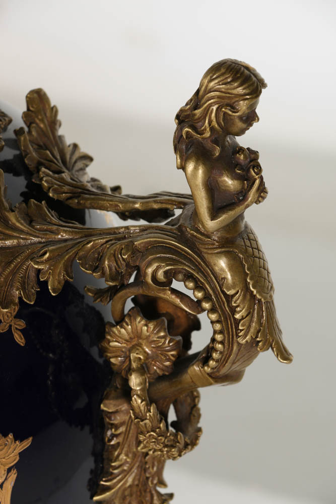 Pair of Porcelain Urns with Figural Handles