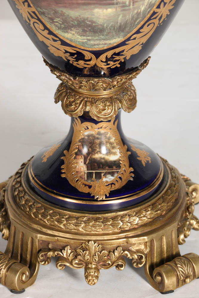 Pair of Porcelain Urns with Figural Handles