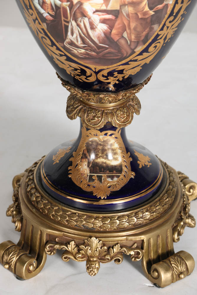 Pair of Porcelain Urns with Figural Handles