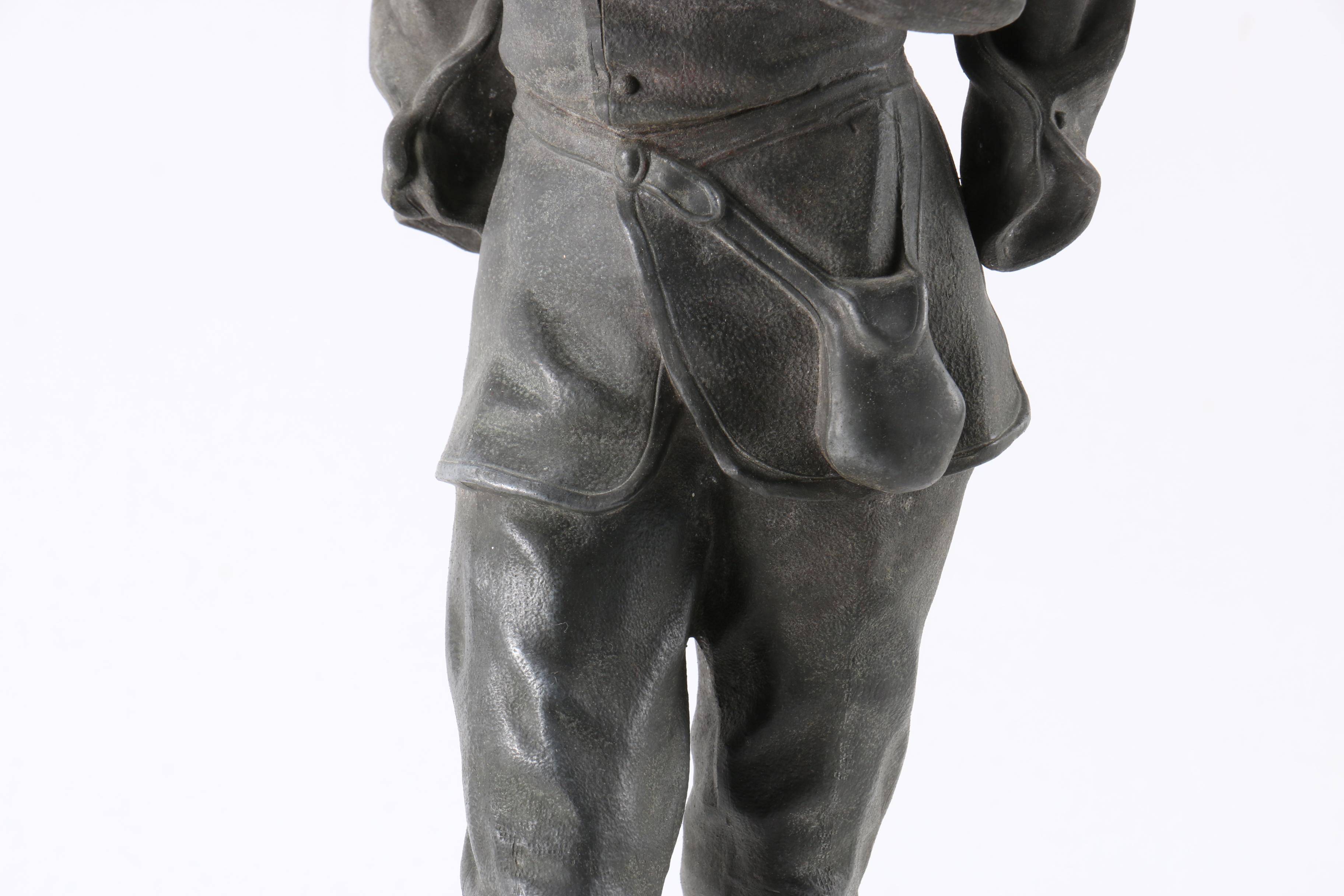 Cast Metal Figures of Peasants