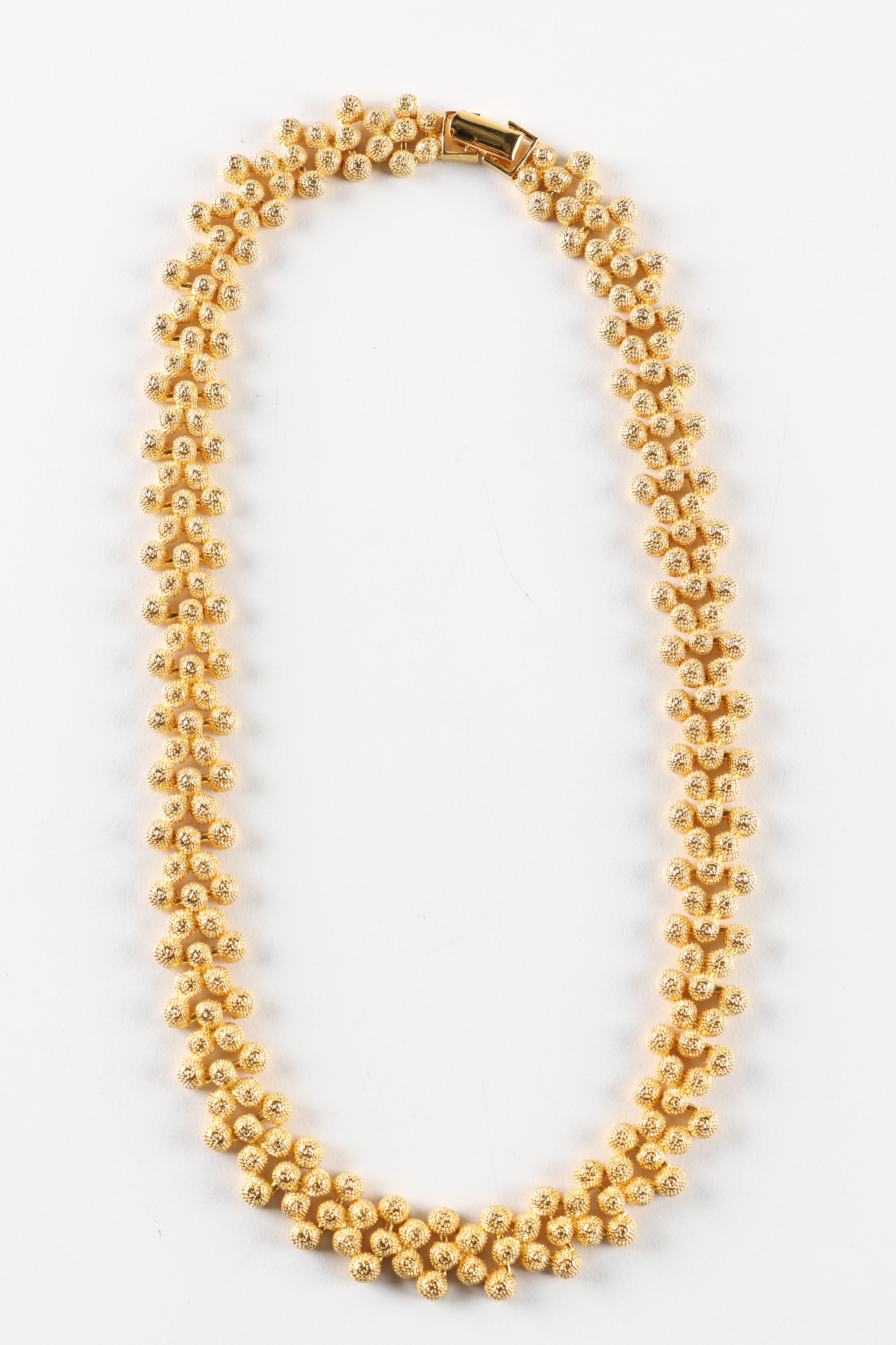 Assortment of Gold-Tone and Wood Costume Jewelry