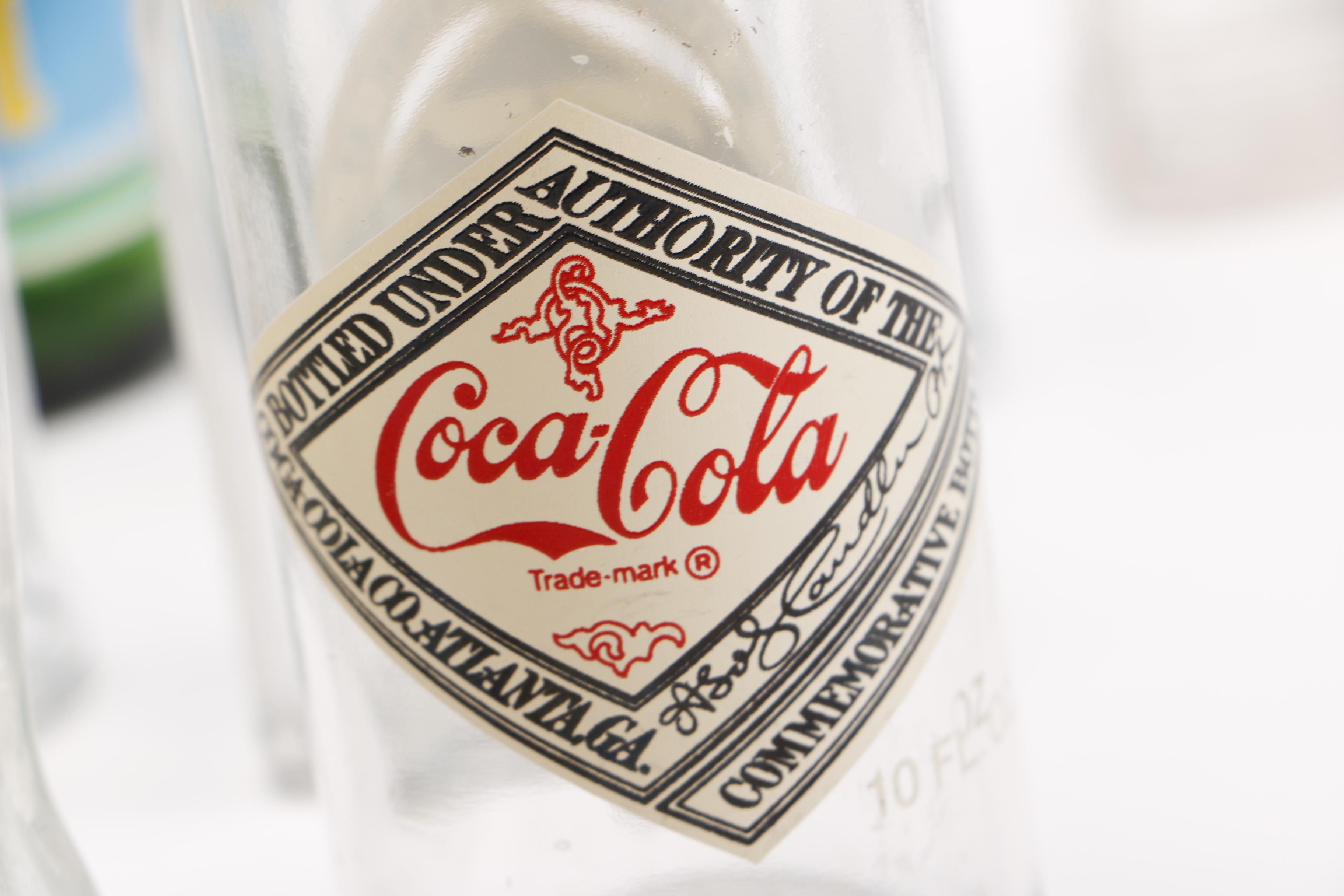 Vintage Glass Bottles Including Coca-Cola, Sloan's Liniment and Three Feathers Whiskey