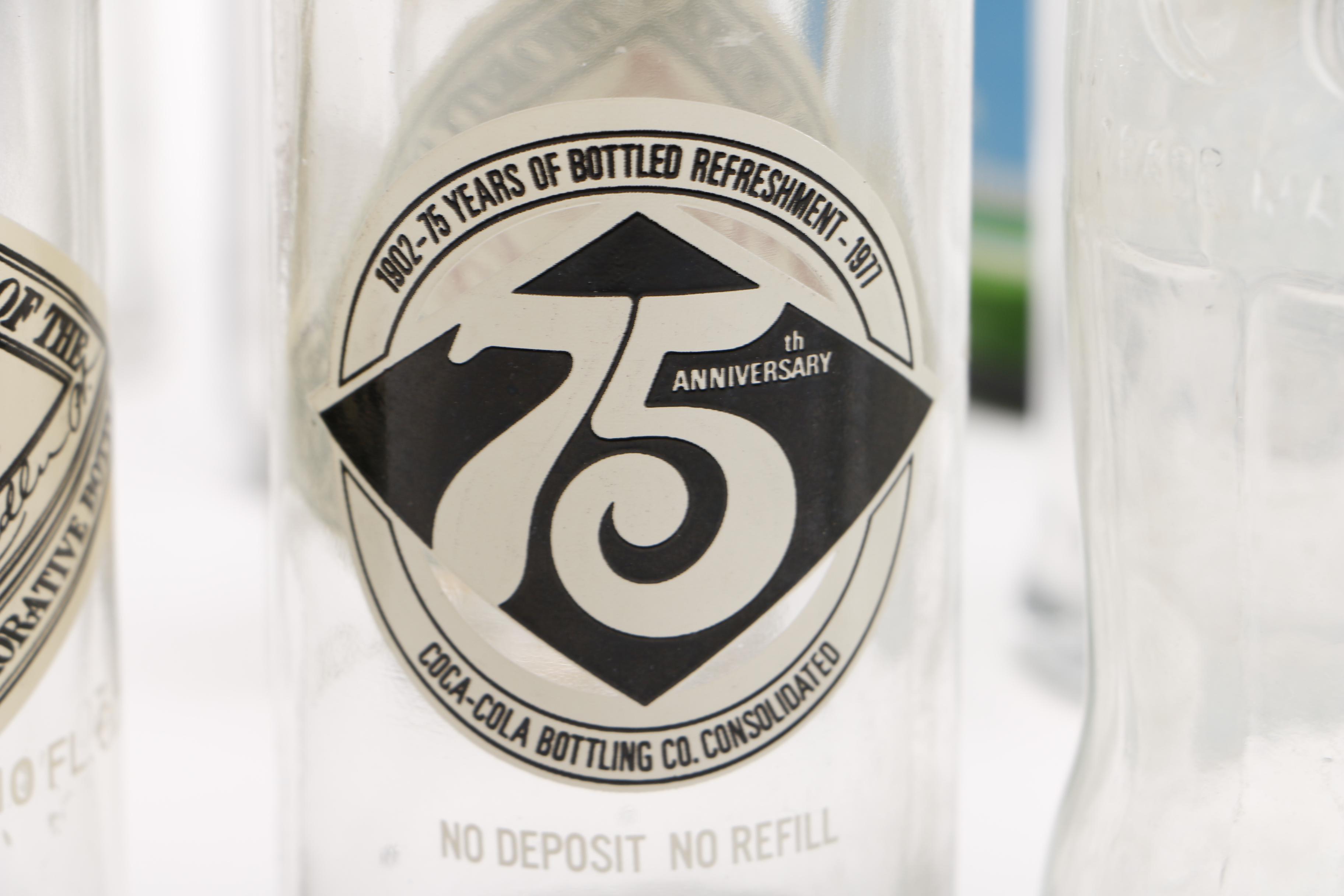 Vintage Glass Bottles Including Coca-Cola, Sloan's Liniment and Three Feathers Whiskey