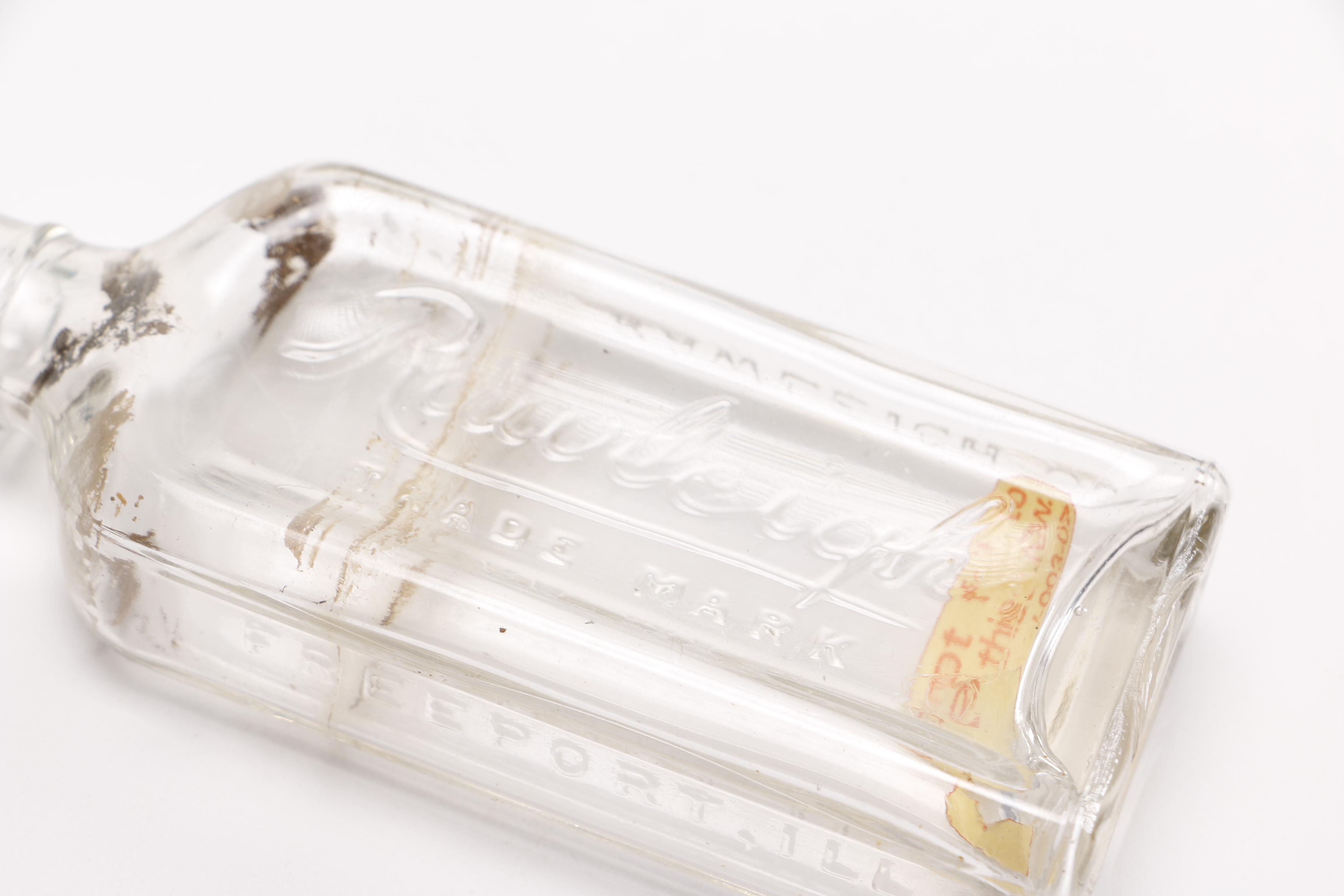 Vintage Glass Bottles Including Coca-Cola, Sloan's Liniment and Three Feathers Whiskey