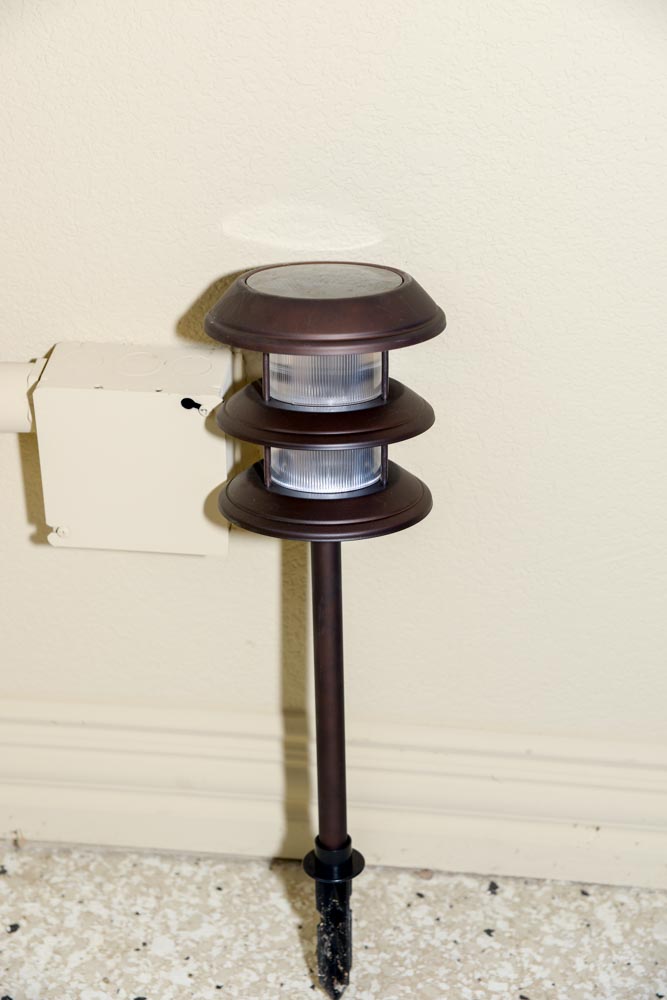 Patio Chairs With Trellis and Landscape Lights