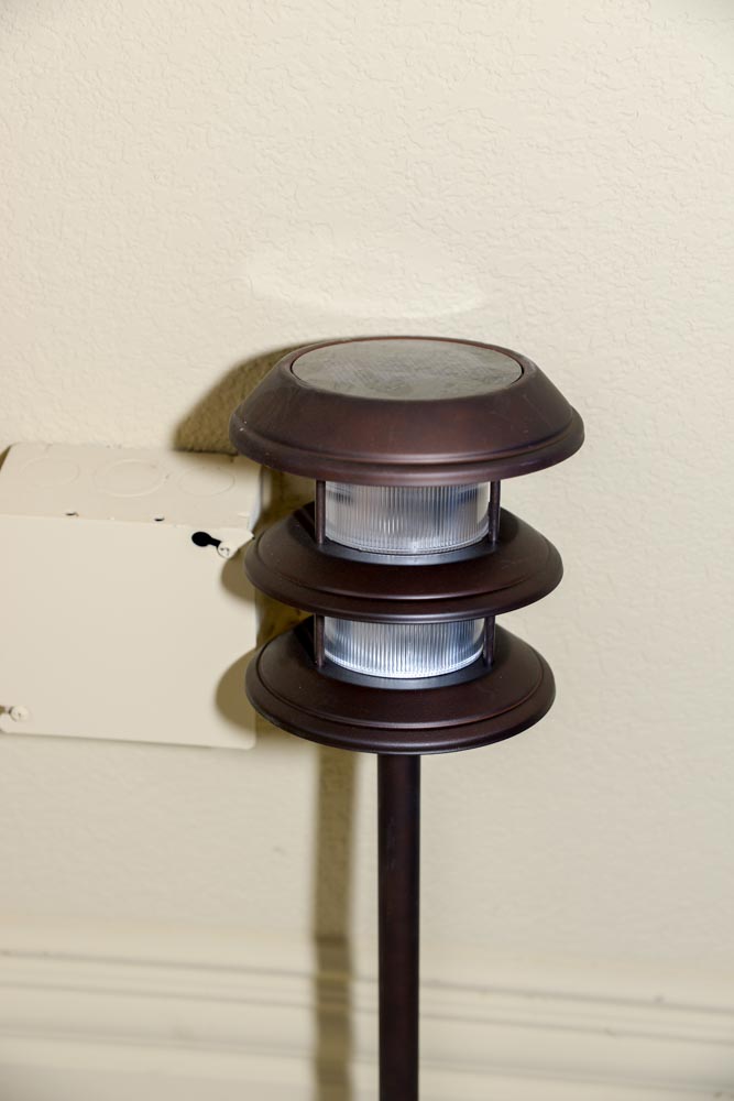 Patio Chairs With Trellis and Landscape Lights