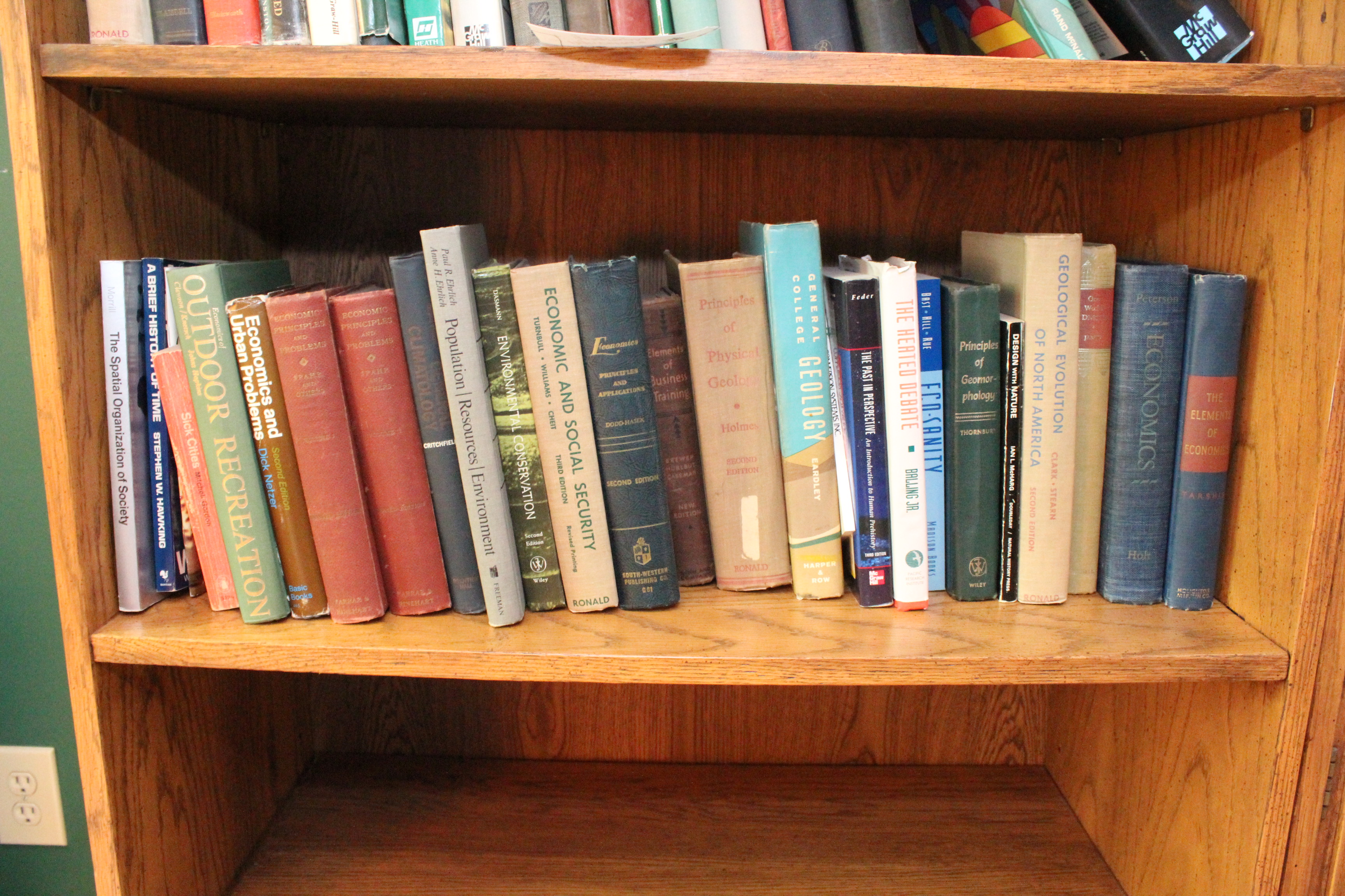 Assortment of Books on Economics, Environmental and Geology.