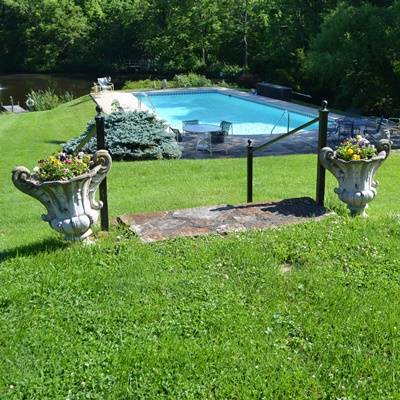 Two Concrete Urn-Shaped Planters