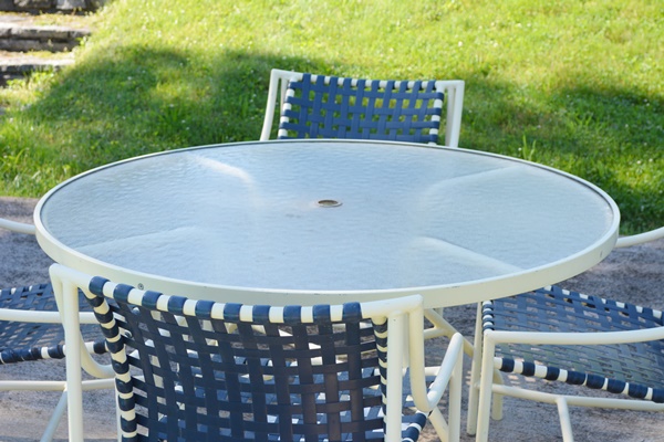 Cream Aluminum Patio Table and Four Chairs