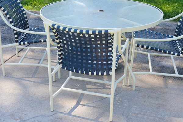 Cream Aluminum Patio Table and Four Chairs