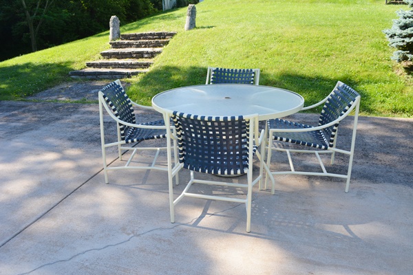 Cream Aluminum Patio Table and Four Chairs