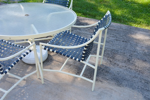 Cream Aluminum Patio Table and Four Chairs