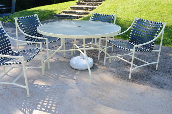 Cream Aluminum Patio Table and Four Chairs