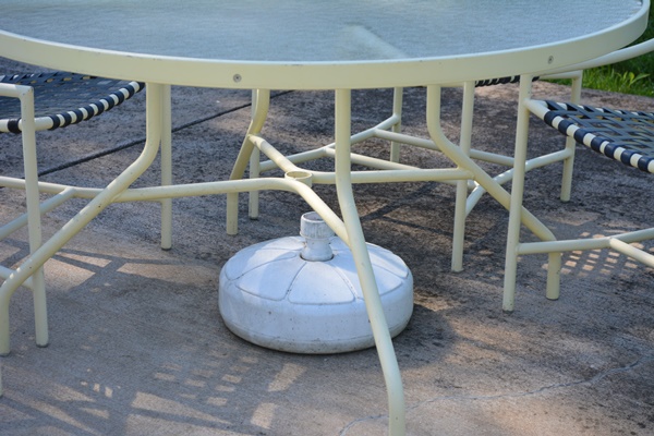 Cream Aluminum Patio Table and Four Chairs