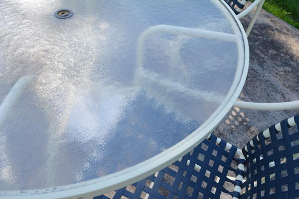 Cream Aluminum Patio Table and Four Chairs