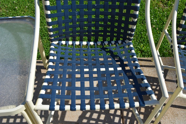 Four Cream Aluminum Patio Chairs and Two Side Tables