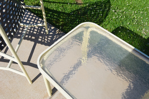 Four Cream Aluminum Patio Chairs and Two Side Tables