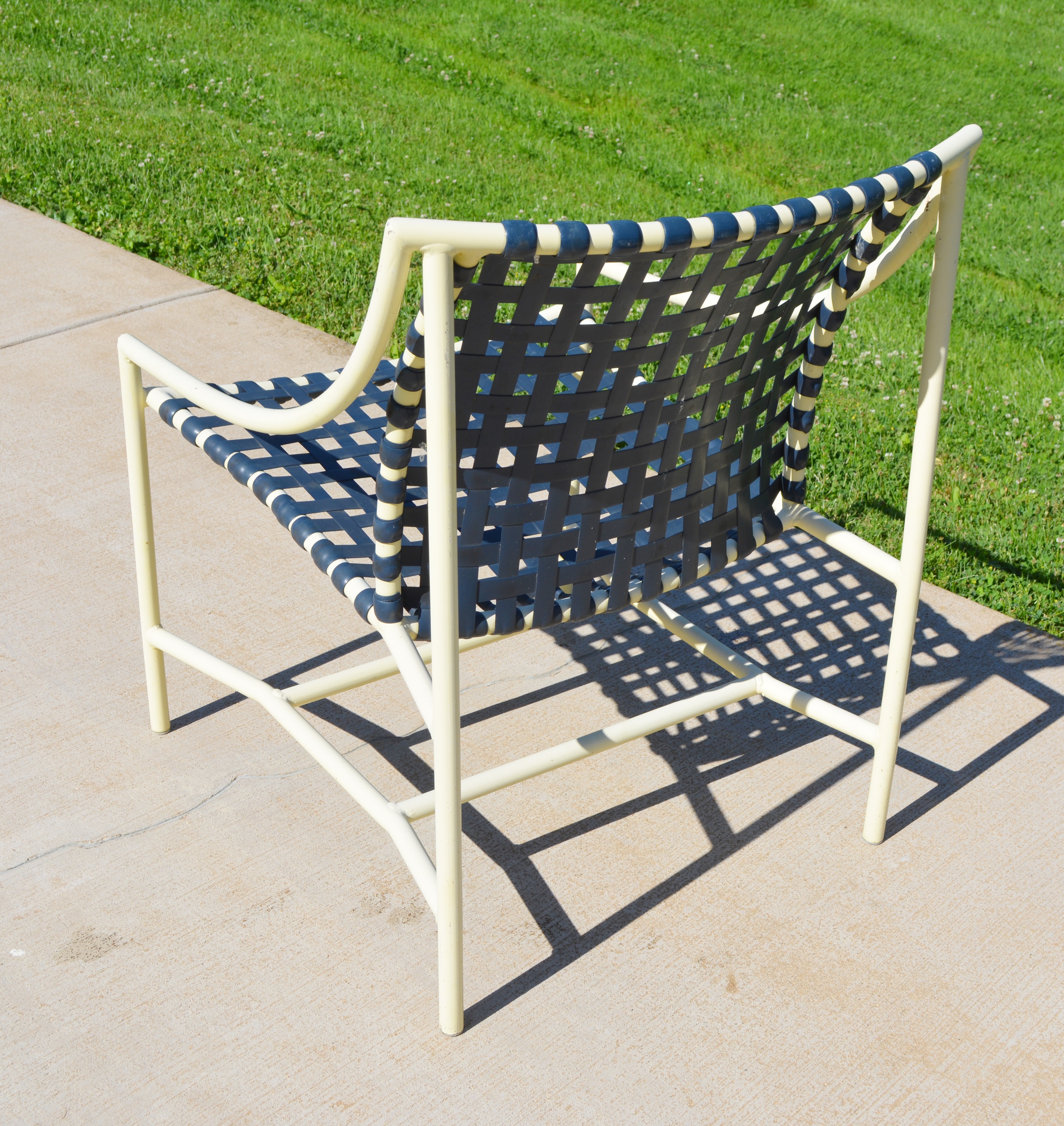 Four Cream Aluminum Patio Chairs and Two Side Tables
