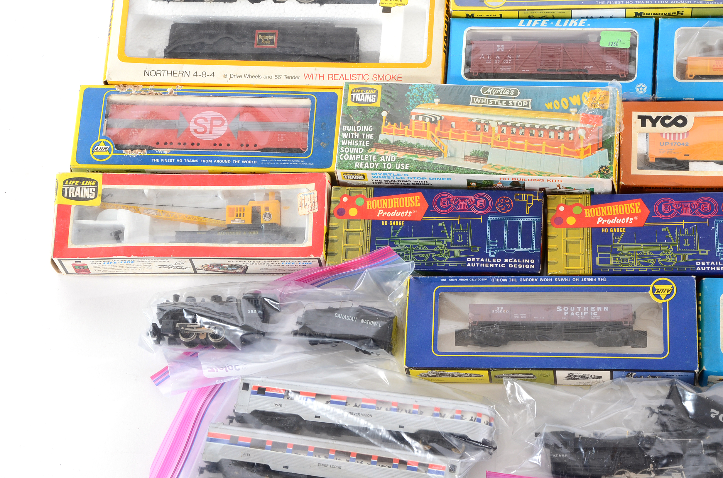 Collection of HO Gauge Locomotives with Train Cars and Accessorie