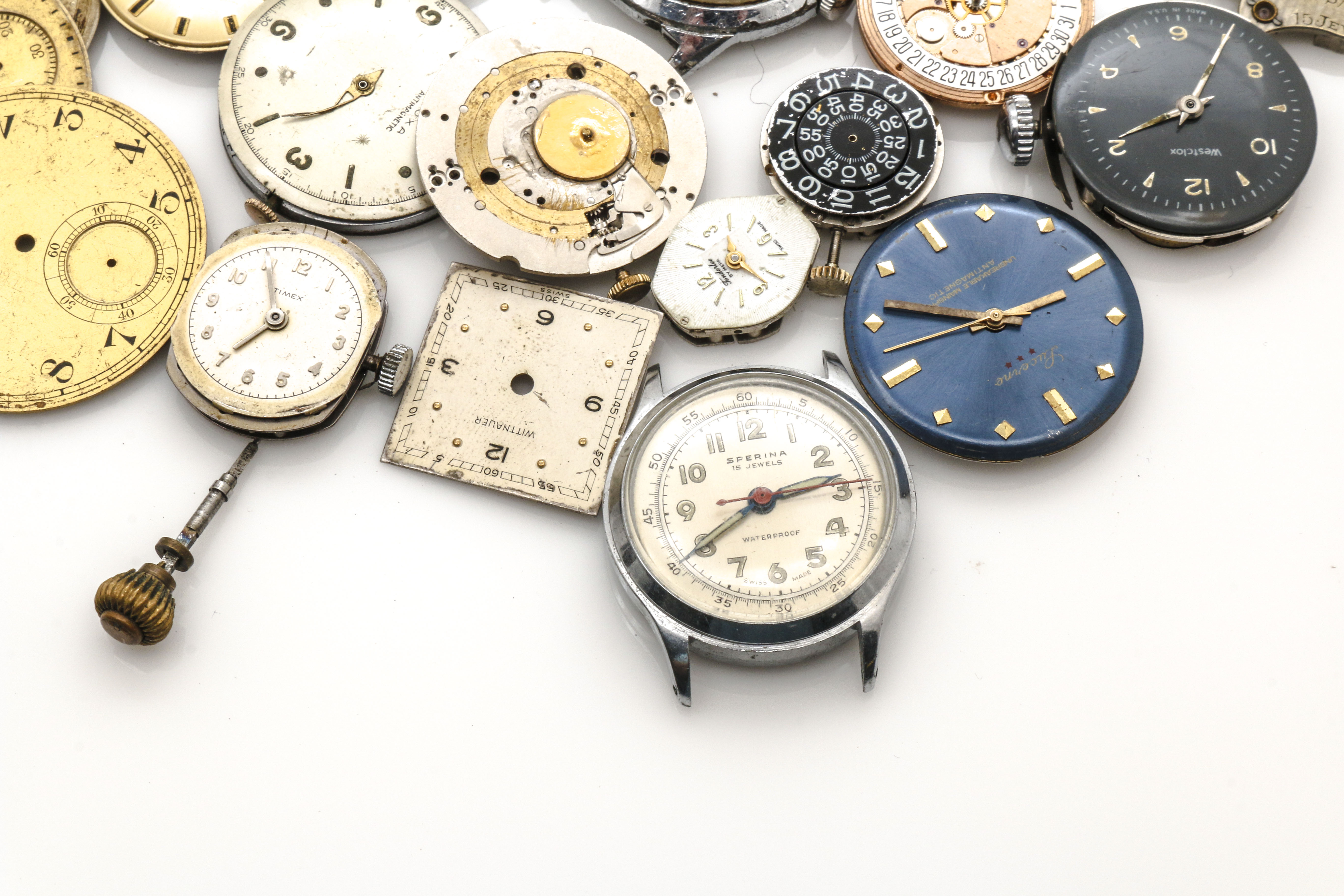 Assortment of Watch Movements, Dials, Cases, and Parts