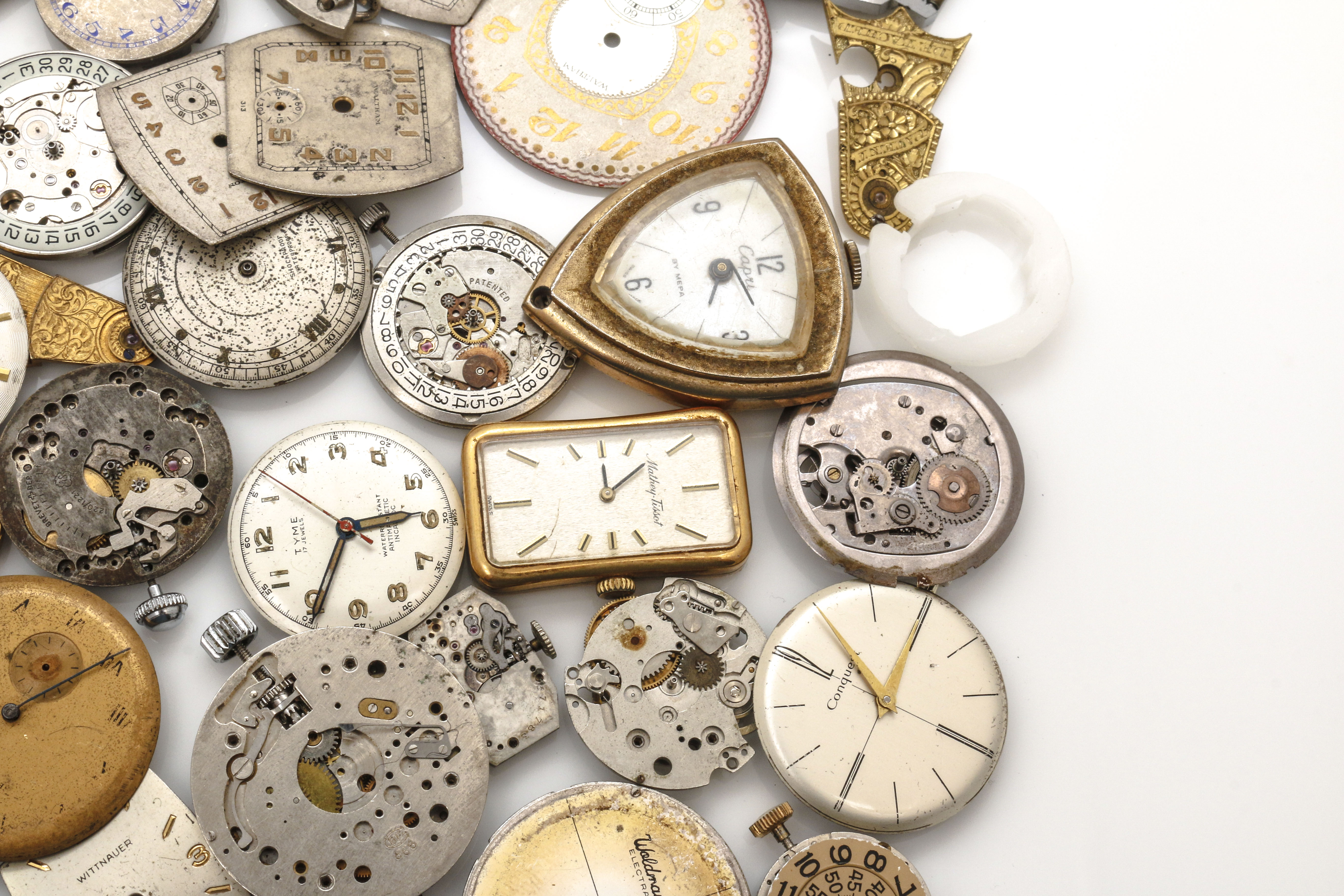 Assortment of Watch Movements, Dials, Cases, and Parts