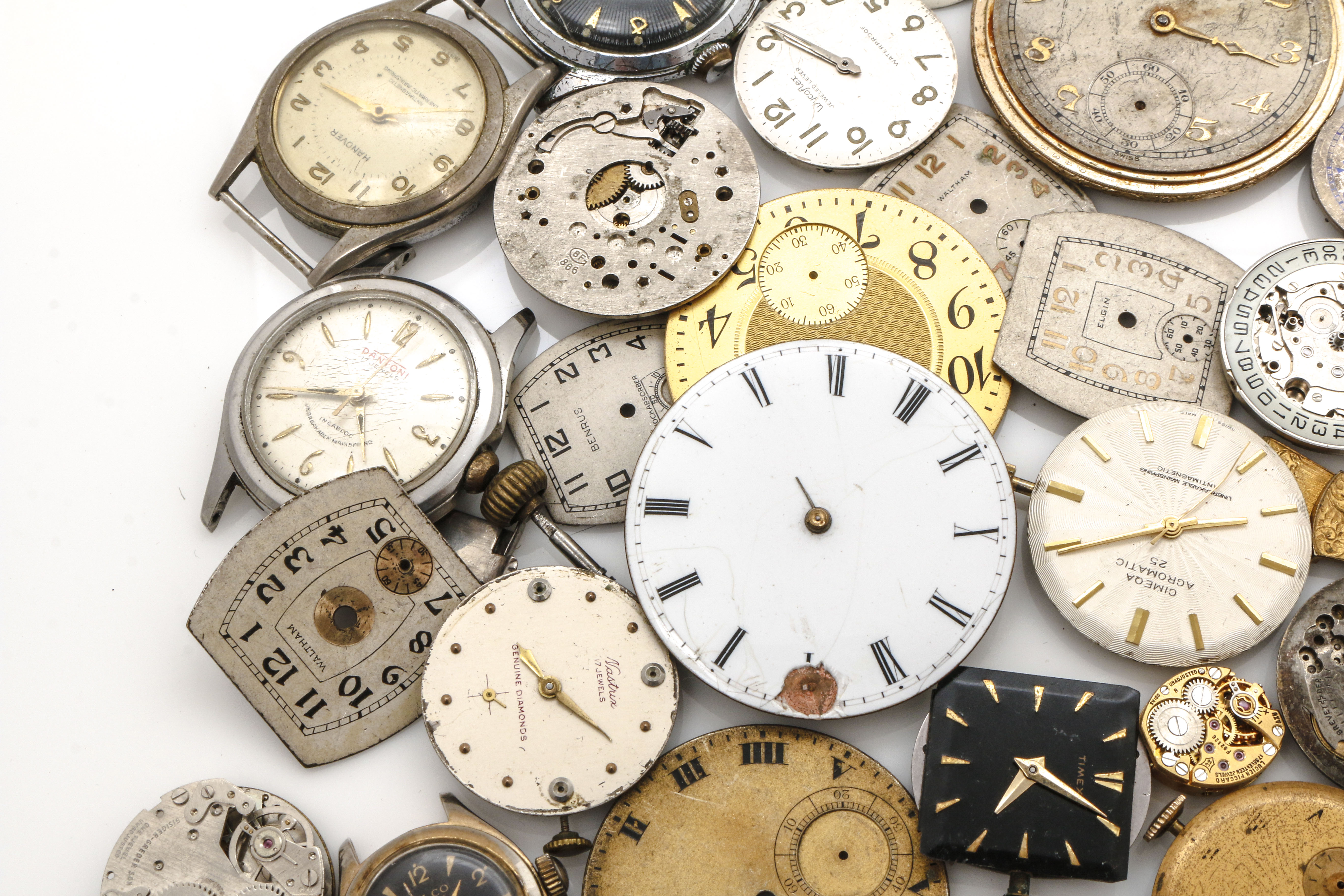 Assortment of Watch Movements, Dials, Cases, and Parts