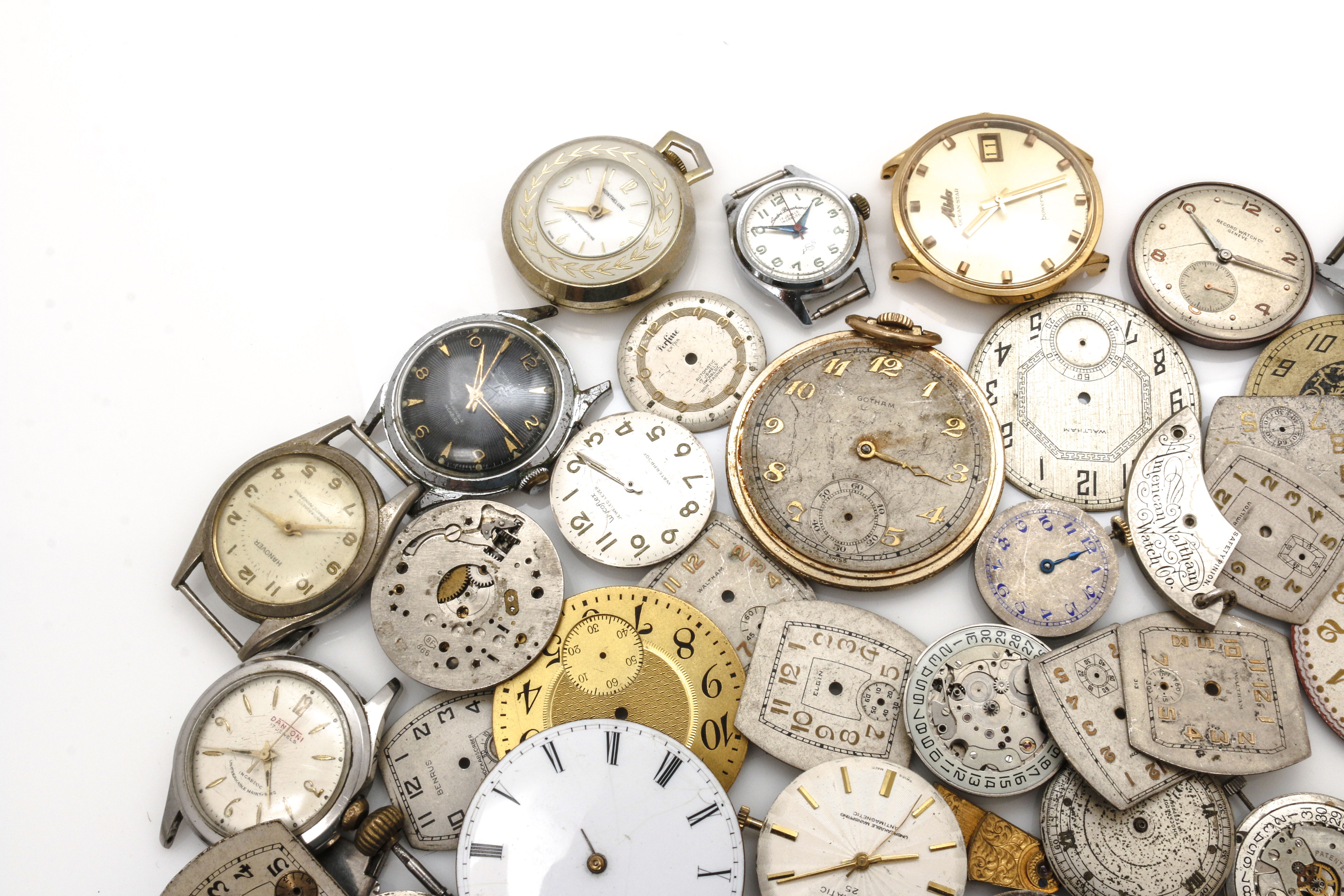 Assortment of Watch Movements, Dials, Cases, and Parts