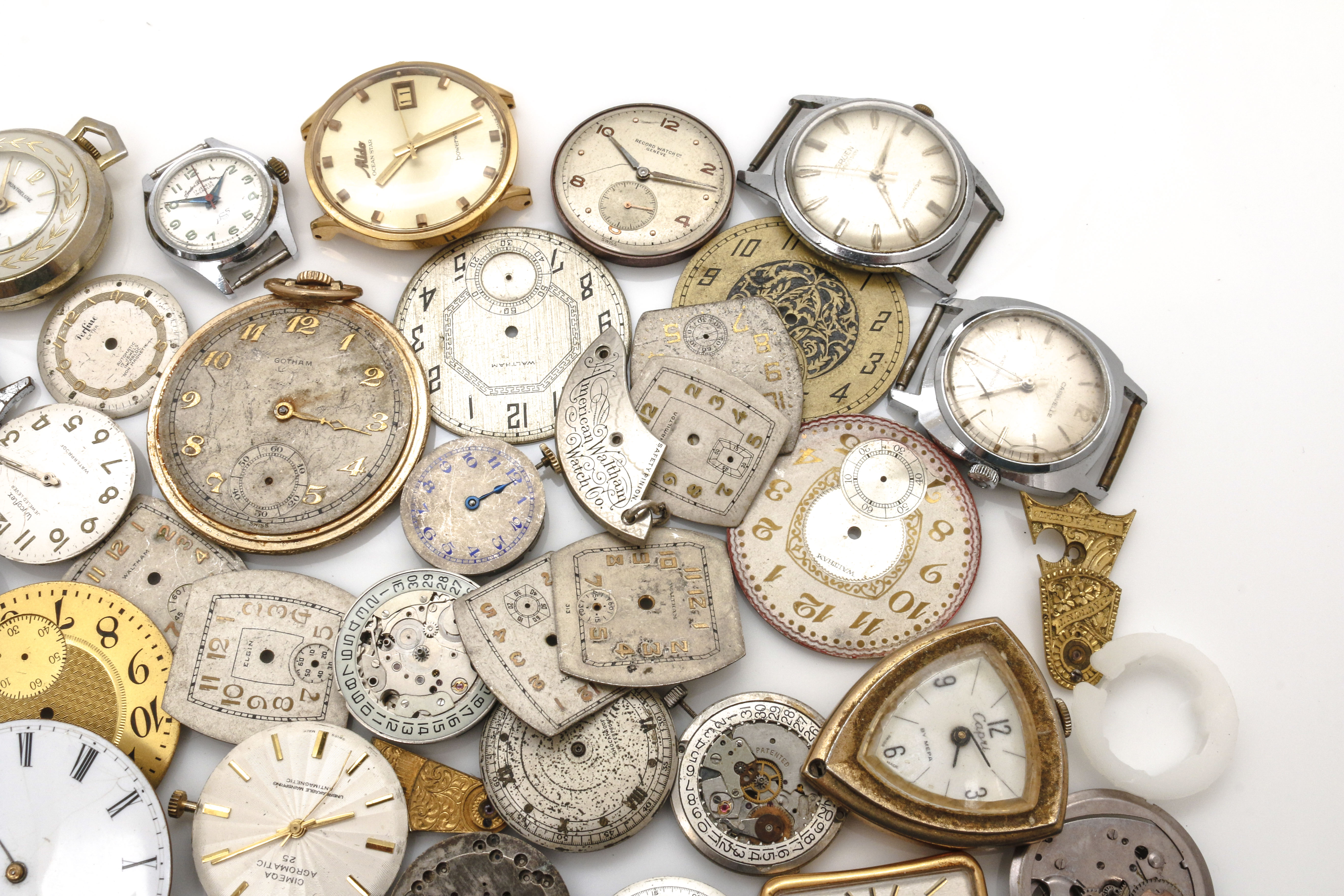 Assortment of Watch Movements, Dials, Cases, and Parts