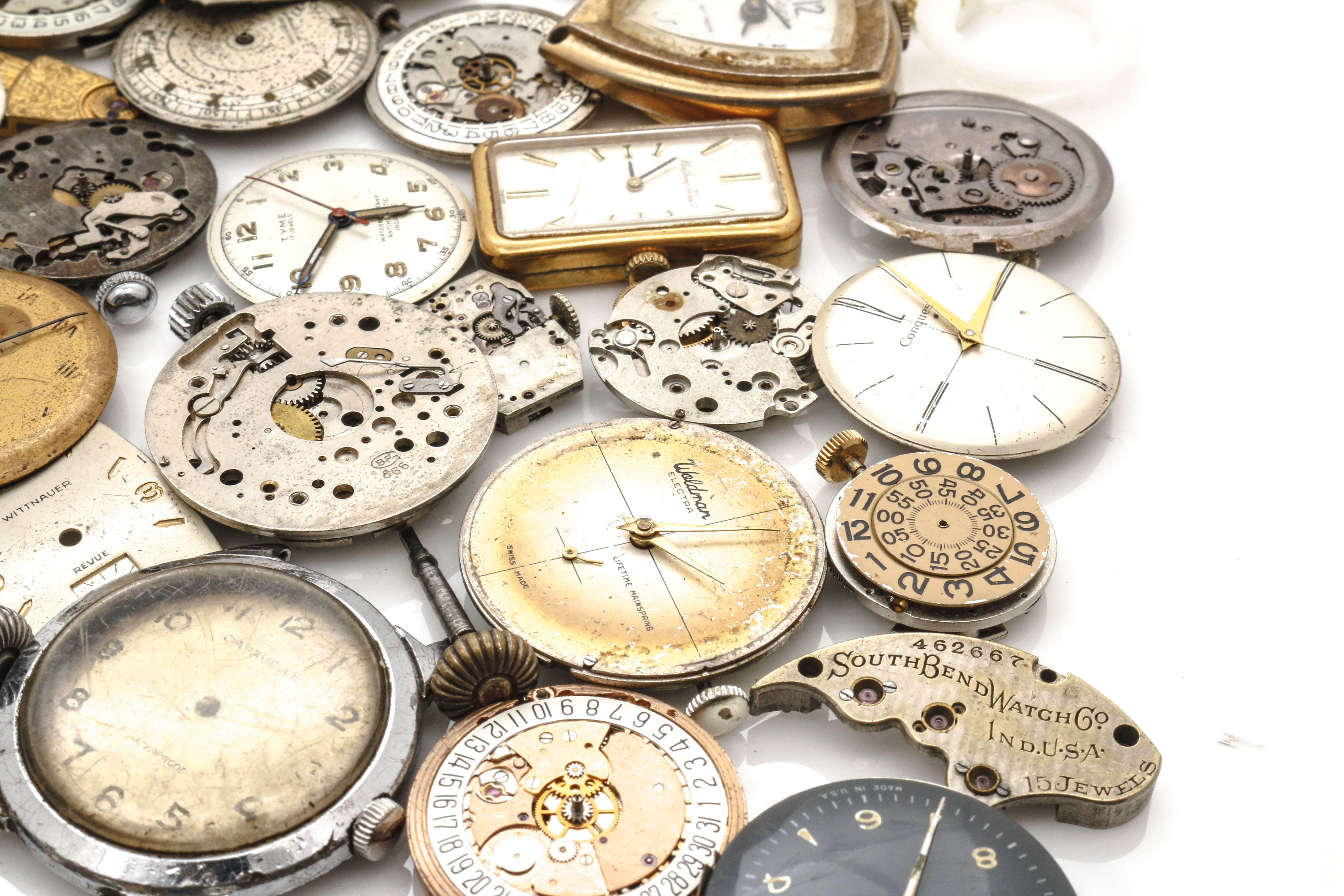 Assortment of Watch Movements, Dials, Cases, and Parts