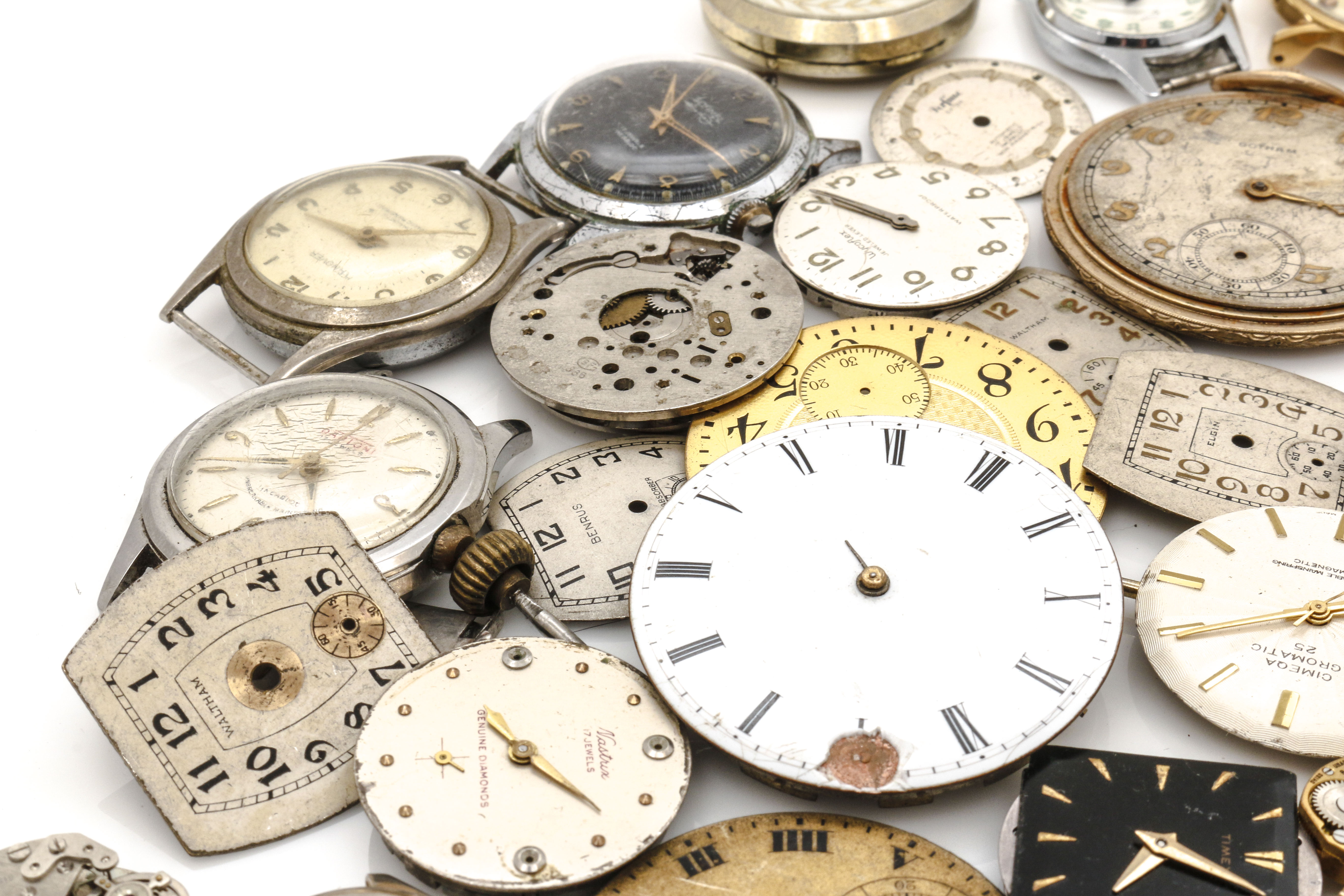 Assortment of Watch Movements, Dials, Cases, and Parts